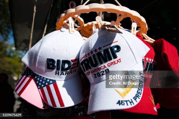 Hats for sale supporting Democratic presidential nominee Joe Biden and U.S. President Donald Trump hang for sale near the White House, on November 5,...