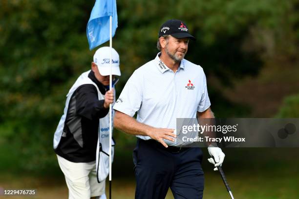 Retief Goosen of South Africa is all smiles after chipping in during the final round of the PGA TOUR Champions Dominion Energy Charity Classic at The...