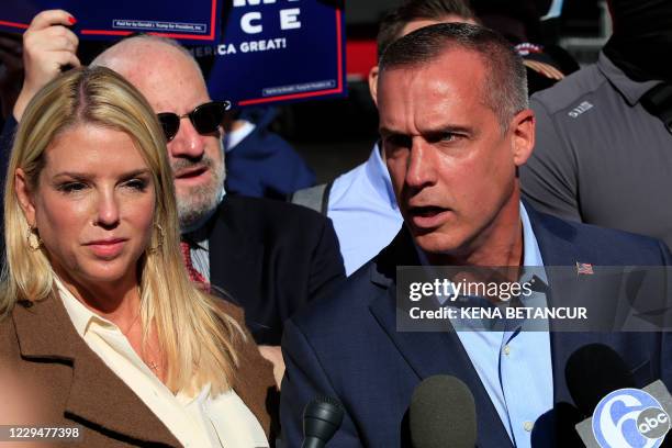 Trump campaign adviser Corey Lewandowski, with former Florida Attorney General Pam Bondi , speaks outside the Pennsylvania Convention Center on...