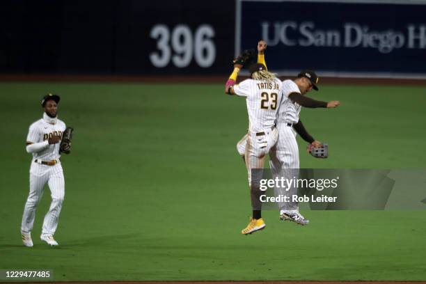 Fernando Tatis Jr. #23 and Trent Grisham of the San Diego Padres celebrate after Game 3 of the Wild Card Series between the St. Louis Cardinals and...