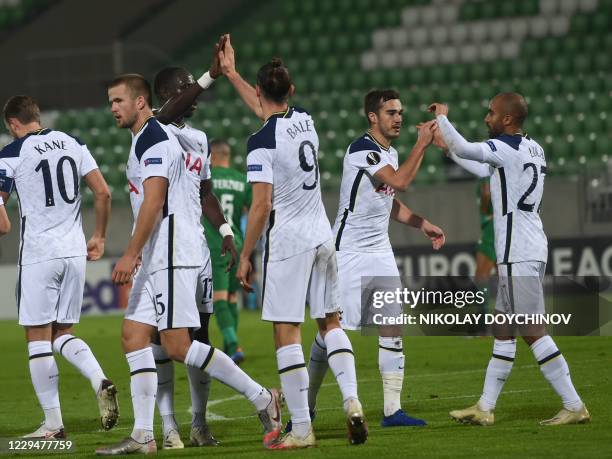 Tottenham's Brasilian midfielder Lucas Moura celebrates with team mates after scoring a goal during the UEFA Europa League group stage football match...