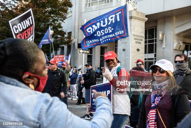 Supporters of U.S. President Donald Trump interact with supporters of Joe Biden, 2020 Democratic presidential nominee, in front of the Convention...