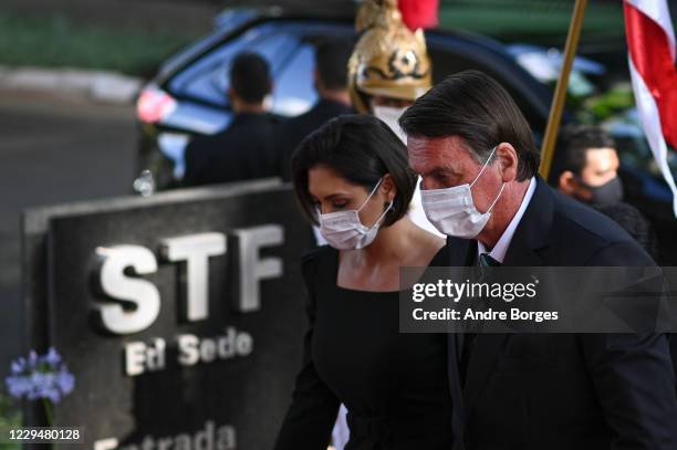 President of Brazil Jair Bolsonaro, next to first lady Michelle Bolsonaro, arrives for the swearing-in ceremony of the new Minister of the Brazilian...