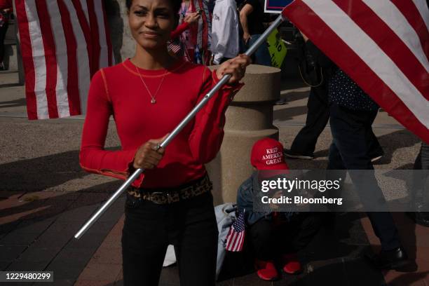 Child wears a "Make America Great" hat at a pro-Trump rally outside State Farm Arena in Atlanta, Georgia, U.S., on Thursday, Nov. 5, 2020. The...