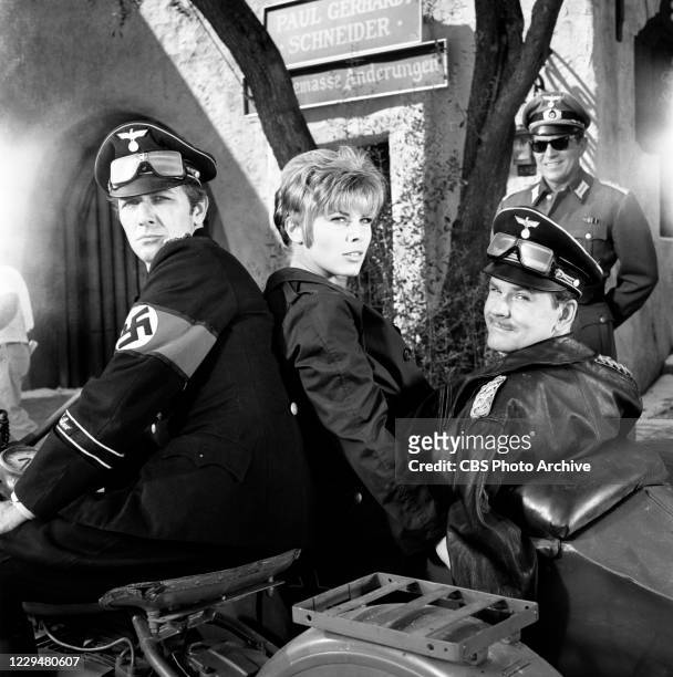 Pictured from left iare actors Richard Dawson , Jayne Massey sitting on Bob Crane's lap in the HOGAN'S HEROES episode, "The Scientist." Image dated...