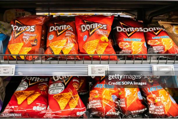 Packets of Doritos tortilla chips seen in a supermarket.