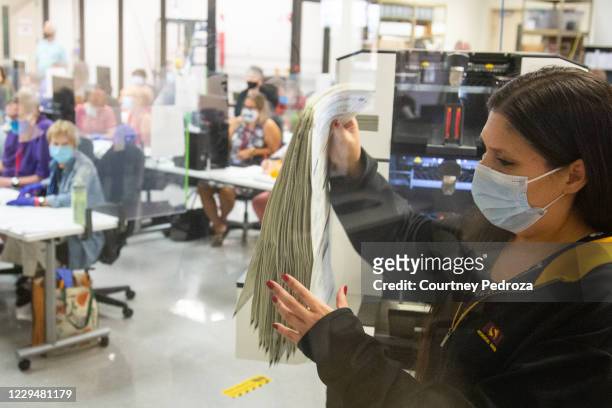 Votes are counted by staff at the Maricopa County Elections Department office on November 5, 2020 in Phoenix, Arizona. Ballots continue to be counted...