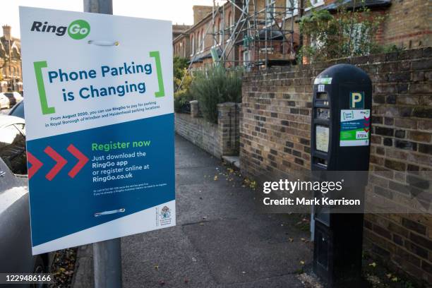 An explanatory notice is displayed alongside a parking meter to be used in conjunction with the RingGo parking application on 31 October 2020 in...