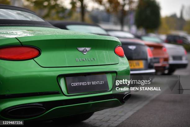 Bentley luxury cars are seen outside a garage in Tunbridge Wells, south-east of London on November 6, 2020. - Bentley have announced their intention...