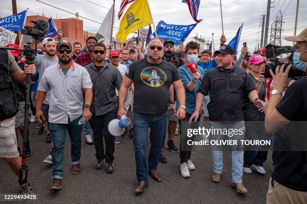 Far-right radio show hostAlex Jones arrives to speak to supporters of US President Donald Trump as they protest in front of the Maricopa County...