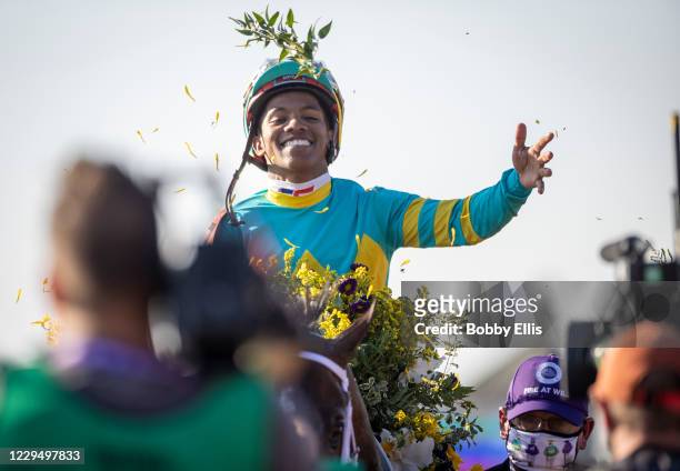 Ricardo Santana, Jr., riding Fire at Will, celebrates after winning the Juvenile Turf on the first day of the Breeders Cup at Keenland on November 6,...
