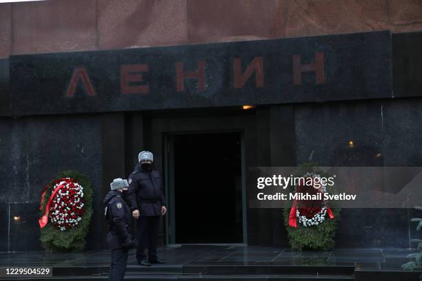 Russian Federal Protective Service agents wearing face mask stand in front of Lenin's Mausoleum, on November 7, 2020 in Red Square in Moscow, Russia....