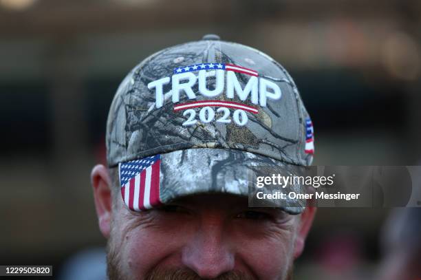 Participant wears a cap reading 'TRUMP 2020' as supporters of the Querdenken movement, which opposes coronavirus lockdown measures and has demanded...