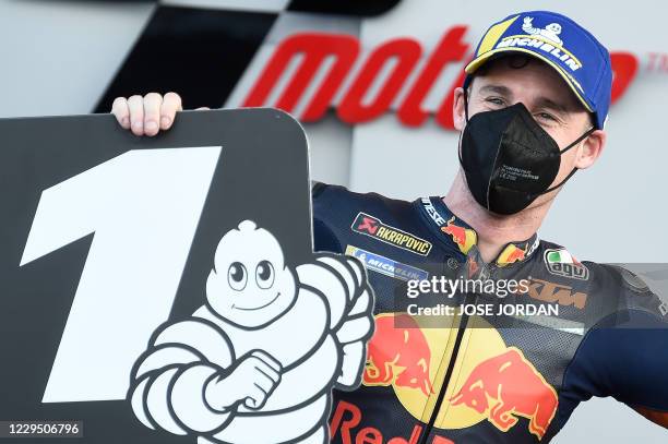 Red Bull KTM Factory Racing's Spanish rider Pol Espargaro celebrates getting the pole after winning the qualifying session of the MotoGP race of the...