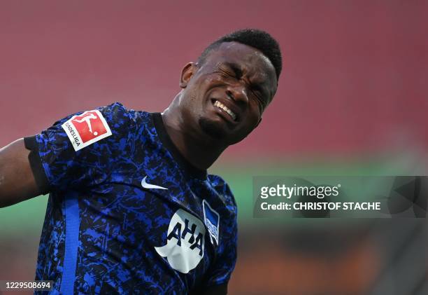 Hertha Berlin's Colombian forward Jhon Cordoba reacts after a foul attack during the German first division Bundesliga football match between FC...