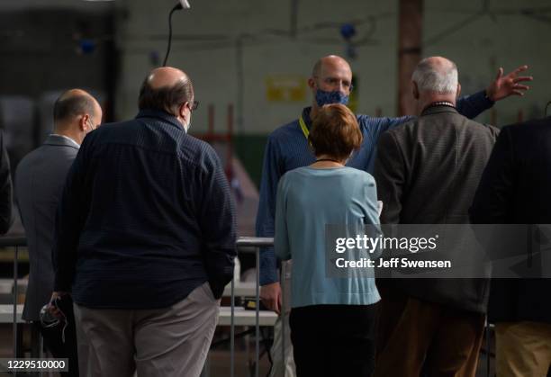 Allegheny County Solicitor Andy Szefi speaks with poll watchers while the counting of ballots continues at the Allegheny County elections warehouse...