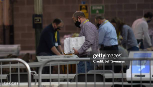 Allegheny County election employees organize ballots at the Allegheny County elections warehouse on November 7, 2020 in Pittsburgh, Pennsylvania....