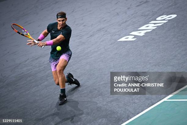 Spain's Rafael Nadal returns the ball to Germany's Alexander Zverev during their men's singles semi-final tennis match on day 6 at the ATP World Tour...