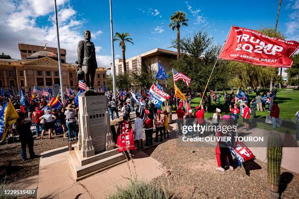 Supporters of US President Donald Trump demonstrate in front of the Arizona State Capitol in Phoenix, Arizona, on November 7, 2020. - Democrat Joe...