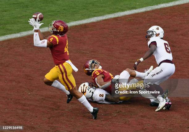 Trojans wide receiver Bru McCoy catches a ball intended for wide receiver Amon-Ra St. Brown in the end zone for a touchdown during a game between the...