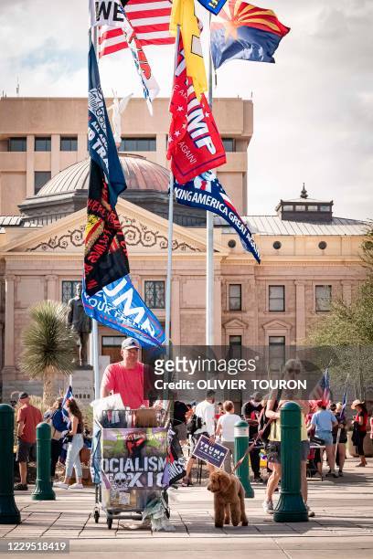 Alan Harrington , from Oregon, came to sell pro Trump flags, as Trump supporters are gathering in front of Arizona State Capitol after the US...