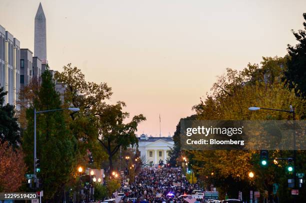 People celebrate near the White House as former Vice President Joe Biden is declared the winner of the U.S. Presidential election in Washington,...