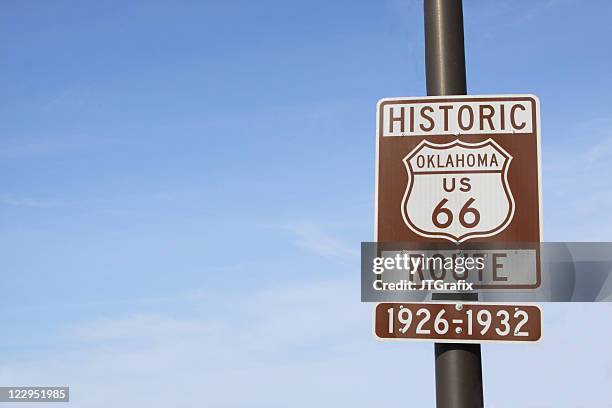 route 66 highway sign in oklahoma with blue sky - oklahoma stock pictures, royalty-free photos & images