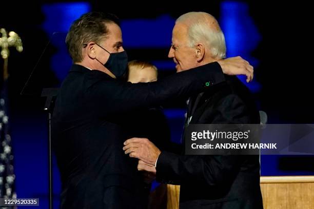 President-elect Joe Biden embraces his son Hunter Biden on stage after delivering remarks in Wilmington, Delaware, on November 7, 2020.