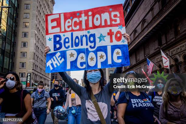 Participant holding a sign at the celebratory march. Thousands of New Yorkers joined members of the Protect the Results: New York City Coalition, a...