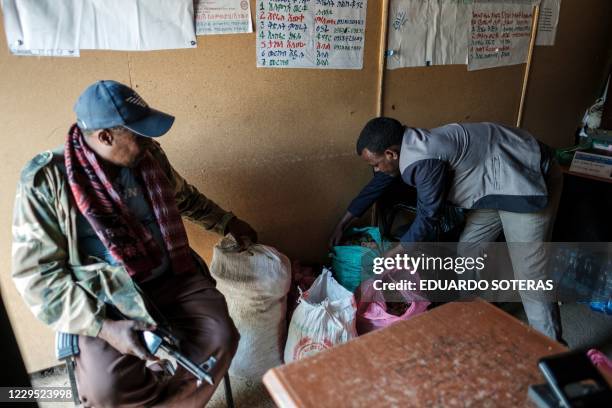 Anmut Mulat local official, checks bags of food donations at his office in the city of Gondar, Ethiopia, on November 8, 2020. Ethiopia's military...