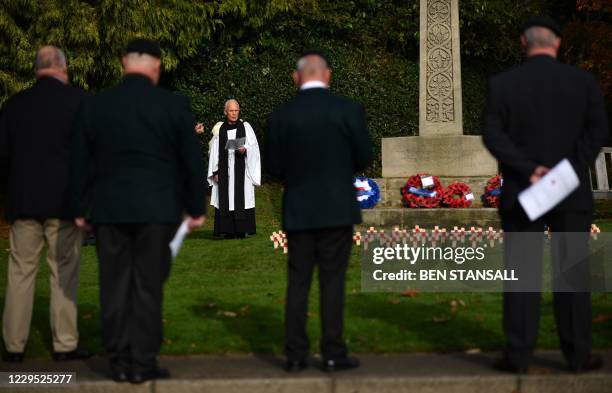 The Vicar of Brenchley Reverend Campbell Paget conducts a socially distanced Remembrance Sunday service at the War Memorial in Brenchley, south east...