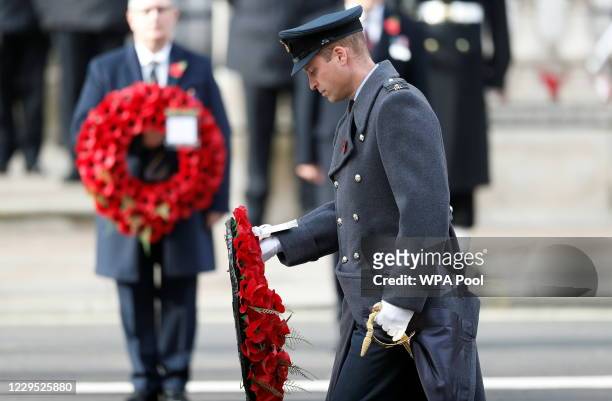 Britain's Prince William, Duke of Cambridge lays a poppy wreath during a National Service of Remembrance at the Cenotaph in Westminster, amid the...