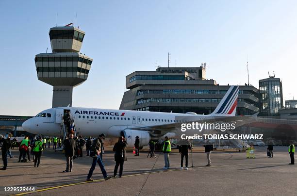 The Air France plane bound for Paris' Charles de Gaulle airport sits on the tarmac before the last take-off from Berlin Tegel airport on November 8,...