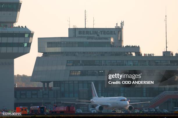 People watch from the tower and visitor terrace as an aircraft of French airline Air France, the last plane to take off from Tegel 'Otto Lilienthal'...