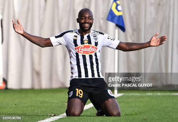 Angers' Cameroonian forward Stephane Bahoken celebrates after scoring a goal during the French L1 football match between Nimes Olympique and Angers...