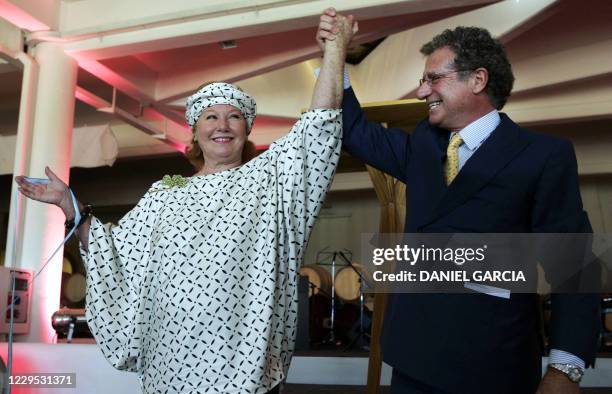Baroness Nadine de Rothschild and French businessman Laurent Dassault wave after cutting the inaugural ribbon at Flechas de los Andes winery 10...