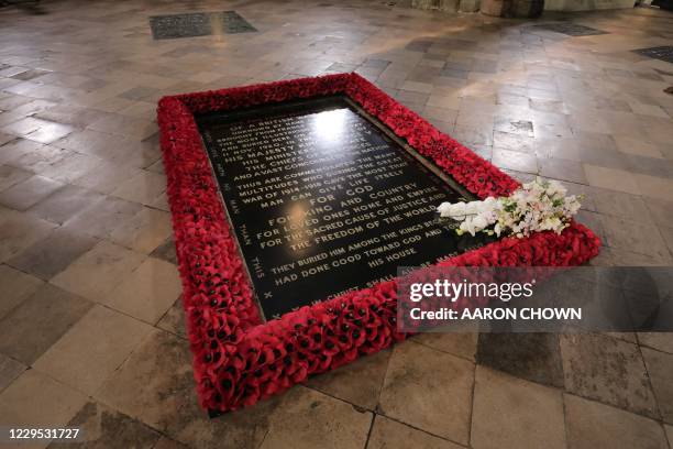 Bouquet of flowers lies on the grave of the Unknown Warrior following a service to mark the centenary of the burial of the Unknown Warrior ahead of...