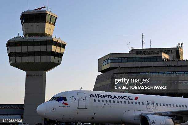 People watch from the tower and visitor terrace as an aircraft of French airline Air France, the last plane to take off from Tegel 'Otto Lilienthal'...