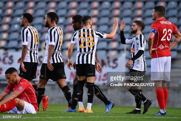 Angers' French forward Jimy Cabot reacts after scoring a goal during the French L1 football match between Nimes Olympique and SCO Angers at the...