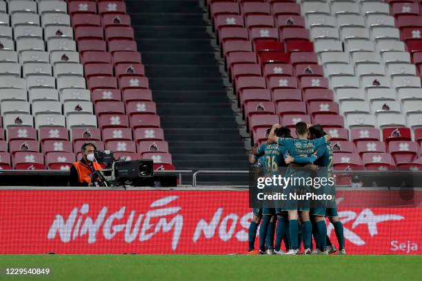 Francisco Moura of SC Braga celebrates with teammates after scoring during the Portuguese League football match between SL Benfica and SC Braga at...