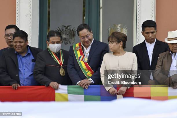 Luis Arce, Bolivia's incoming president, center, and David Choquehuanca, Bolivia's vice president, third left, stand on the presidential balcony...