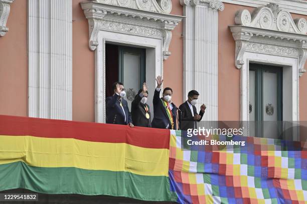 Luis Arce, Bolivia's incoming president, center right, and David Choquehuanca, Bolivia's incoming vice president, center left wave from the...