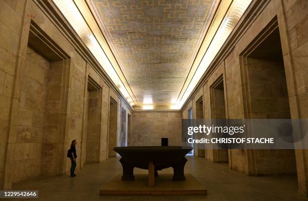 Visitor stands at the Goldener Saal inside the Zeppelintribuene granstand at the Zeppelinfeld of the Reichsparteitagsgelaende in Nuremberg, southern...