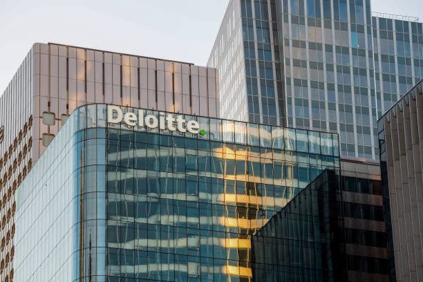 The Deloitte logo outside the Deloitte LLP office building in the La Defense business district of Paris, France, on Monday, Nov. 9, 2020. France's...