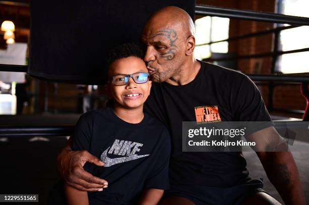 Closeup portrait of former heavyweight champion Mike Tyson posing with his son, Morocco Tyson, during photo shoot at the offices of Tyson Ranch. El...