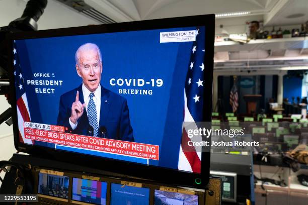 President-elect Joe Biden is shown speaking on a monitor about coronavirus disease in the briefing room of the White House on November 9, 2020 in...