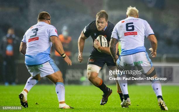 Edinburgh's Andries Ferreira takes on Cardiff's Dmitri Arhip and Josh Turnbull during a Guinness Pro14 match between Edinburgh and Cardiff Blues at...