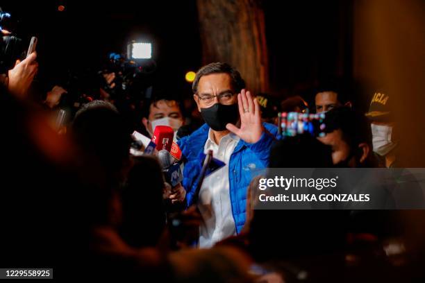 Former Peruvian President Martín Vizcarra waves to the press upon his arrival home after leaving the Presidential Palace in Lima,on November 09...
