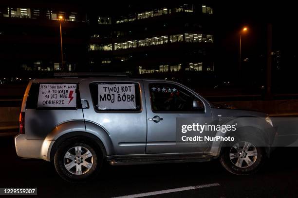 Women's rights activists and their supporters are seen in their cars marked with protest banners during a car protest of the third week of Women's...