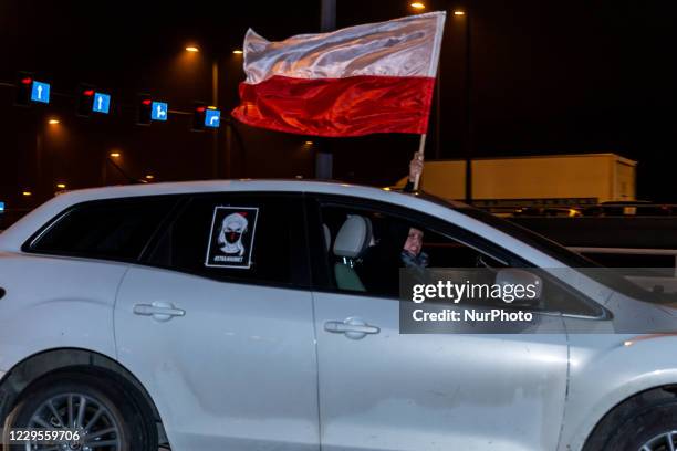 Women's rights activists and their supporters are seen in their cars marked with protest banners during a car protest of the third week of Women's...